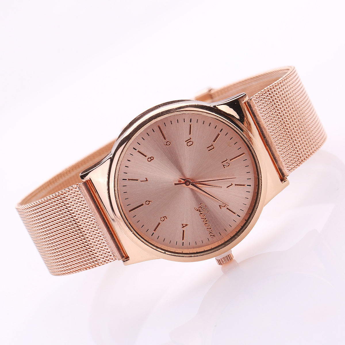 TitanGold Outdoor Sports Watch with a rose gold mesh strap and minimalist dial design.